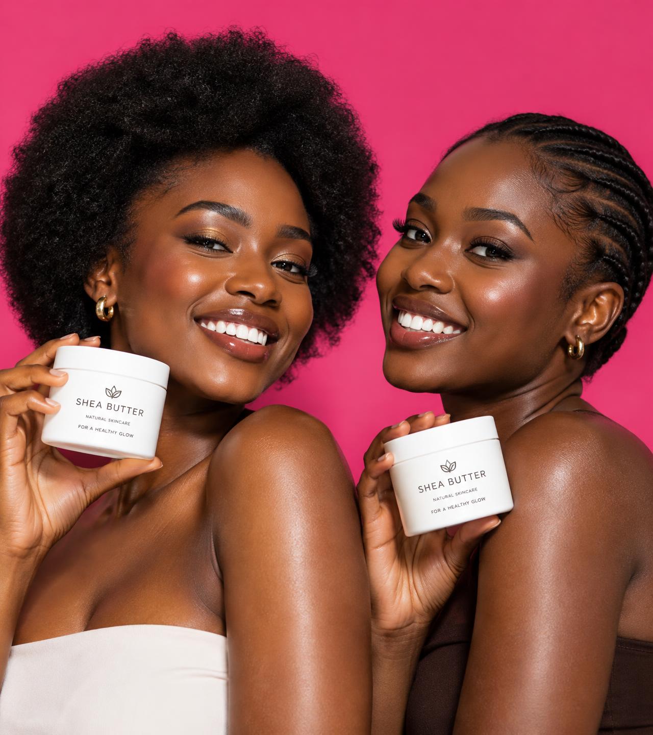 Two confident young Ghanaian women holding shea butter jars
